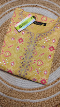 Yellow with peach center embroidery